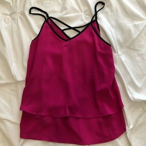 Magenta tank top with criss cross detail at back